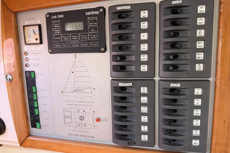 Slide: The Image of Control panel of a 2006 Island Spirit 401 yacht with various switches and indicators. - 30