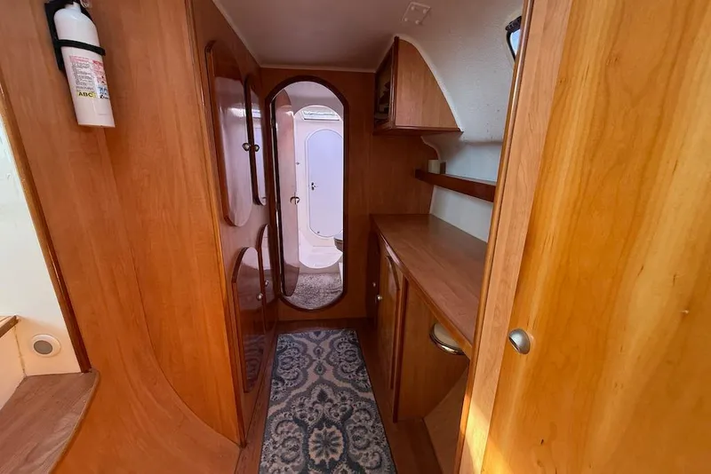 Slide: The Image of Interior of 2006 Island Spirit 401 yacht with wooden cabinetry and carpeted floor. - 33