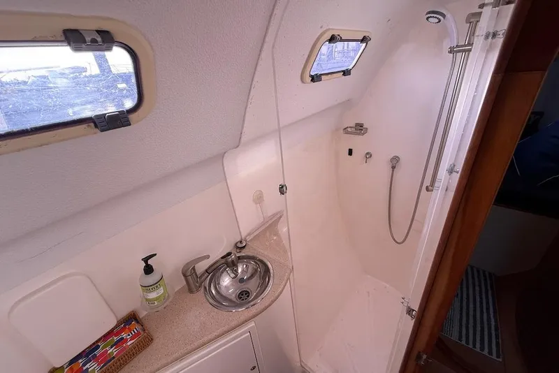 Slide: The Image of Bathroom interior of 2006 Island Spirit 401 yacht with sink and shower. - 47