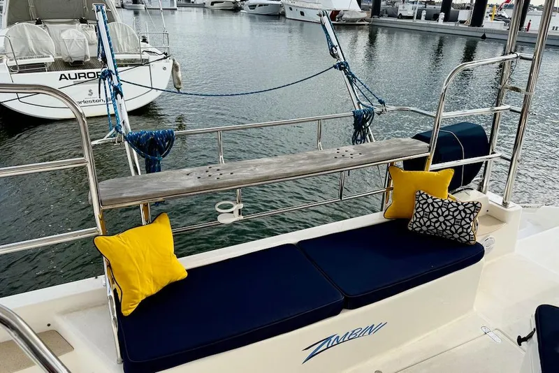 Slide: The Image of Cozy seating area on 2006 Island Spirit 401 yacht with colorful cushions at marina. - 7