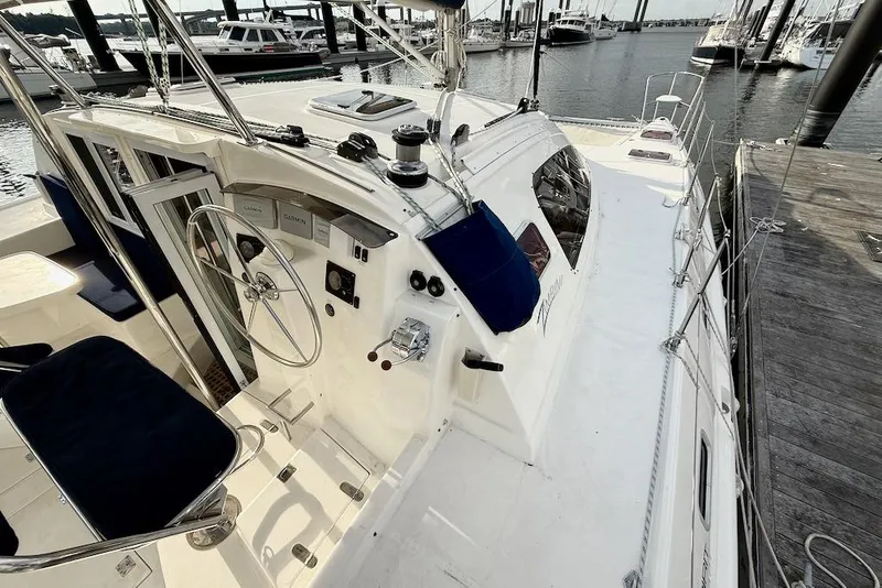 Slide: The Image of 2006 Island Spirit 401 sailboat docked, featuring helm and navigation equipment. - 8