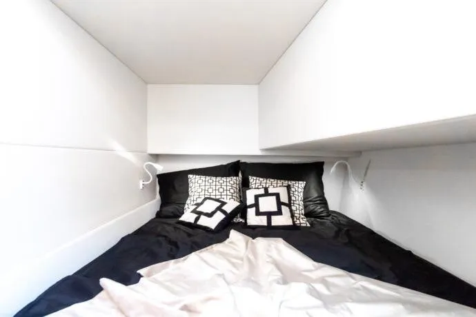 Slide: The Image of Luxurious cabin interior of 2026 Dracan 42 Catamaran with modern bedding and ambient lighting. - 35