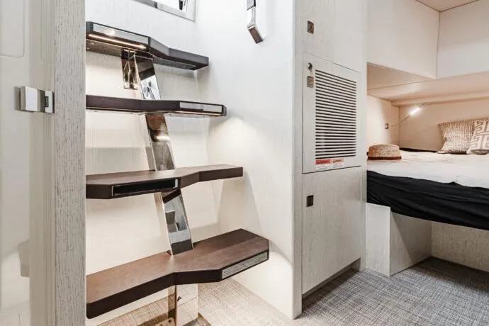 Slide: The Image of Modern interior of 2026 Dracan 42 Catamaran with sleek staircase and cozy bedroom. - 36