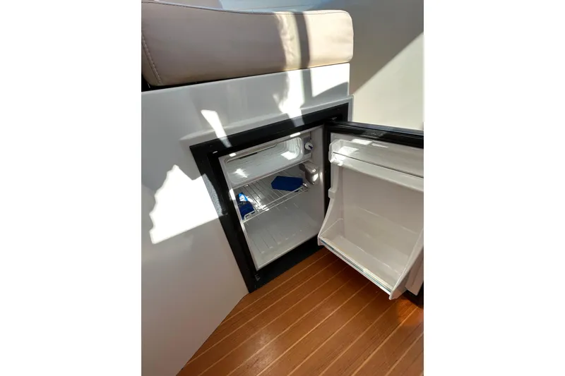 Slide: The Image of Interior of 2008 Back Cove 33 yacht with seating, table, and cabinetry. - 23