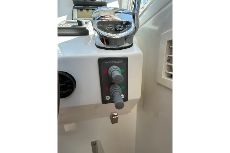 Slide: The Image of 2008 Back Cove 33 boat interior showing control panel and air vent. - 26