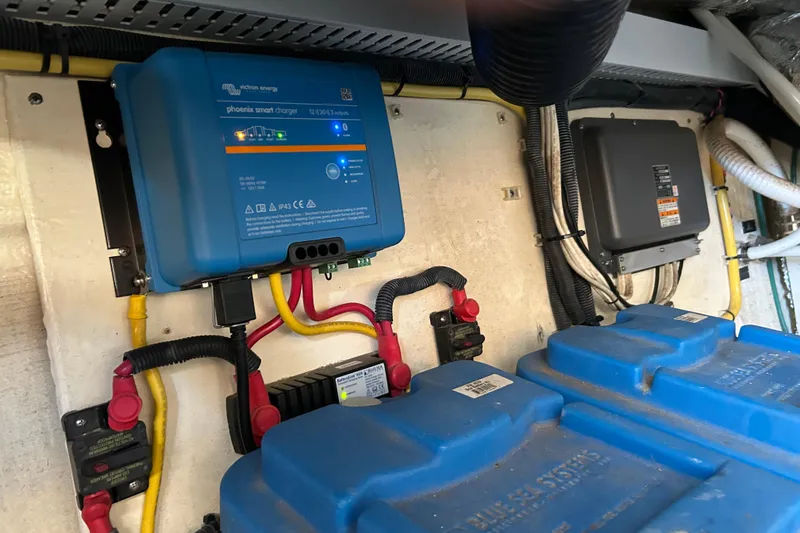 Slide: The Image of Teak deck flooring on a 2008 Back Cove 33 boat, featuring metal hatch fittings. - 31