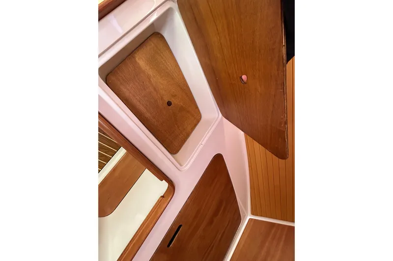 Slide: The Image of Interior of 2008 Back Cove 33 boat with wooden paneling and storage compartments. - 41