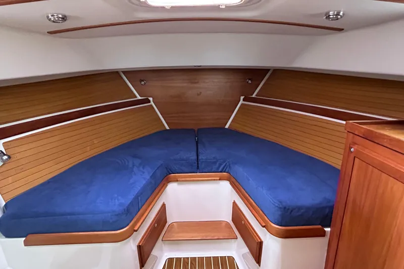 Slide: The Image of 2008 Back Cove 33 boat interior with wood paneling and overhead hatch. - 46