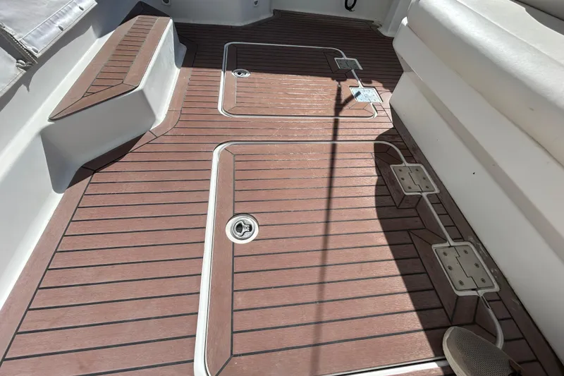 Slide: The Image of 2008 Back Cove 33 boat roof with railing, overlooking serene lake and forest. - 6