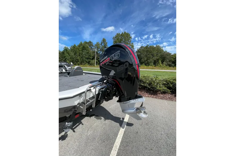 Slide: The Image of 2025 Vexus AVX1980 boat with powerful outboard motor, parked on a sunny day. - 4