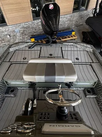 Slide: The Image of 2025 Vexus ACX2150 boat interior with Garmin controls and sleek design. - 11