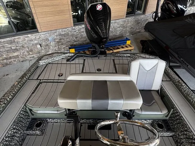 Slide: The Image of 2025 Vexus ACX2150 boat interior with seating and steering wheel, showcasing modern design. - 12