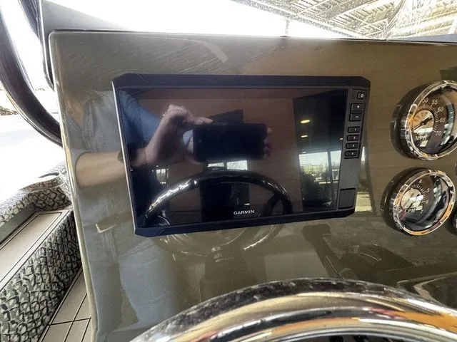 Slide: The Image of Dashboard of 2025 Vexus ACX2150 with Garmin display and gauges. - 6