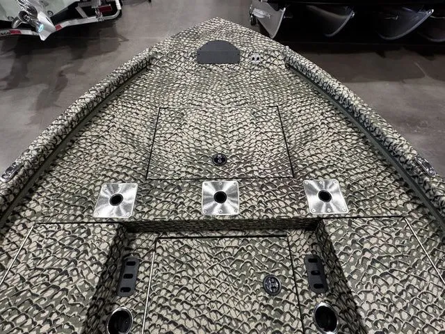 Slide: The Image of 2025 Vexus ACX2000 boat deck with textured pattern and multiple rod holders. - 8