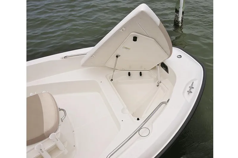 Slide: The Image of Manufacturer Provided Image: 2021 Boston Whaler 180 Dauntless bow storage compartment open on calm water. - 8