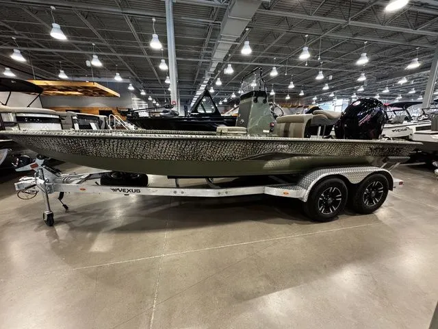 The Image of 2025 Vexus ACX2000 boat on trailer in showroom, featuring sleek design and modern features. - 1