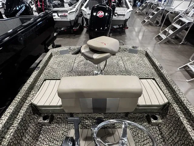 Slide: The Image of 2025 Vexus ACX2000 boat interior with camouflage design and seating arrangement. - 10