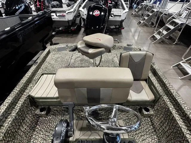 Slide: The Image of 2025 Vexus ACX2000 boat interior with camo design and modern steering wheel. - 11