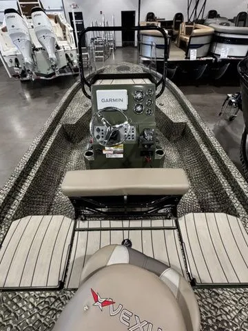 Slide: The Image of 2025 Vexus ACX2000 boat interior with Garmin navigation system, showroom display. - 4