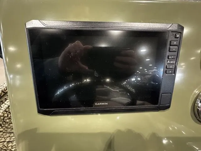 Slide: The Image of Garmin display on 2025 Vexus ACX2000 dashboard, reflecting interior lights. - 6