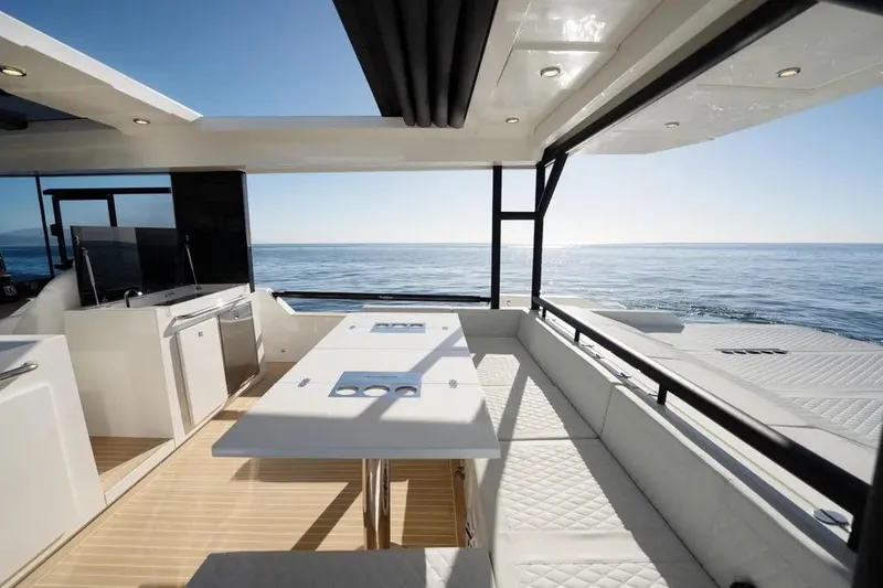 Slide: The Image of Luxurious 2026 De Antonio Yachts D50 interior with ocean view, featuring sleek design and modern amenities. - 10