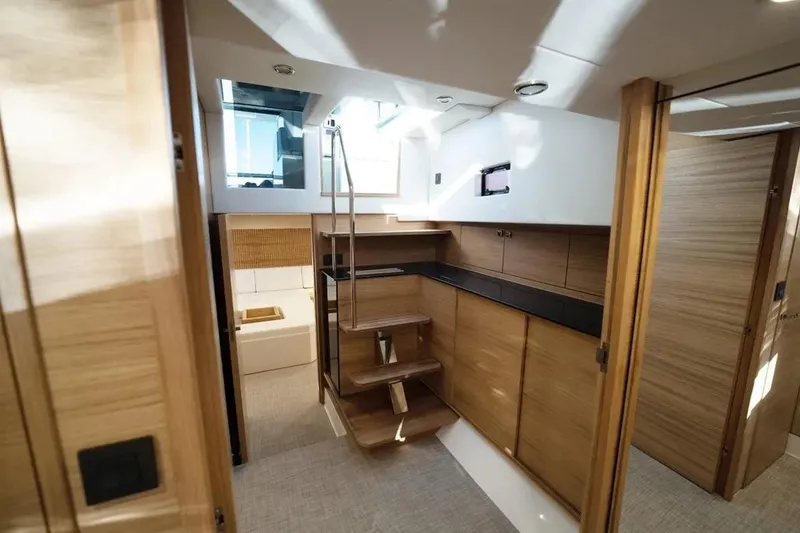 Slide: The Image of Interior of 2026 De Antonio Yachts D50, featuring modern wood finishes and sleek design. - 21