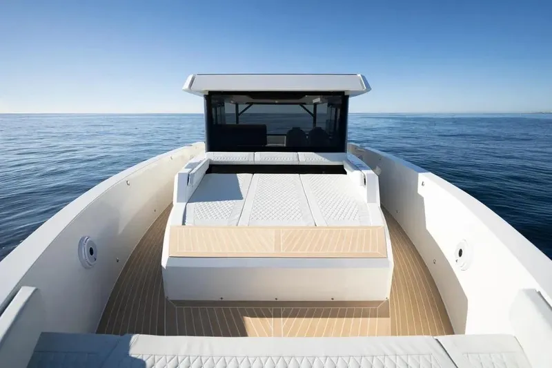 Slide: The Image of 2026 De Antonio Yachts D50 on calm sea, showcasing sleek design and spacious deck. - 6