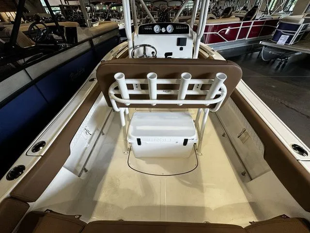 Slide: The Image of 2025 Pioneer ISLANDER 202 boat interior with rod holders and seating. - 5