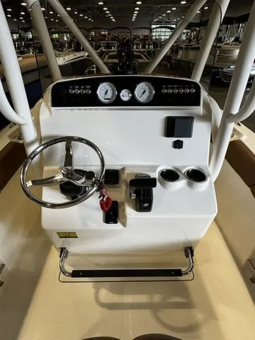 Slide: The Image of 2025 Pioneer ISLANDER 202 boat dashboard with steering wheel and controls. - 6