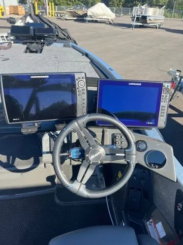 Slide: The Image of 2025 Ikon Boats VLX21 dashboard with dual navigation screens and steering wheel. - 4