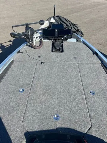 Slide: The Image of 2025 Ikon Boats VLX21 fishing deck with mounted electronics and carpeted surface. - 6