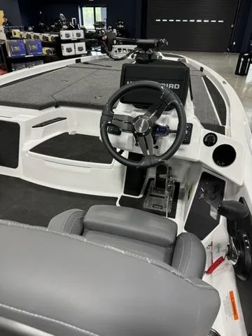 Slide: The Image of 2025 Ikon Boats VLX21 interior with steering wheel and dashboard controls. - 4