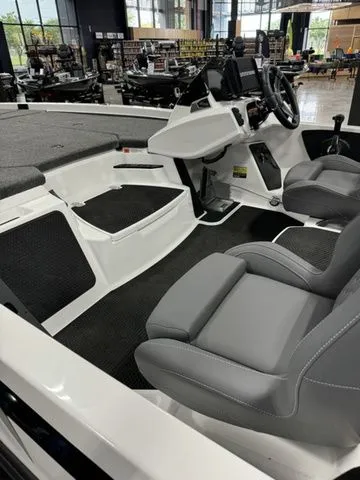 Slide: The Image of 2025 Ikon Boats VLX21 interior with modern seating and sleek dashboard design. - 7
