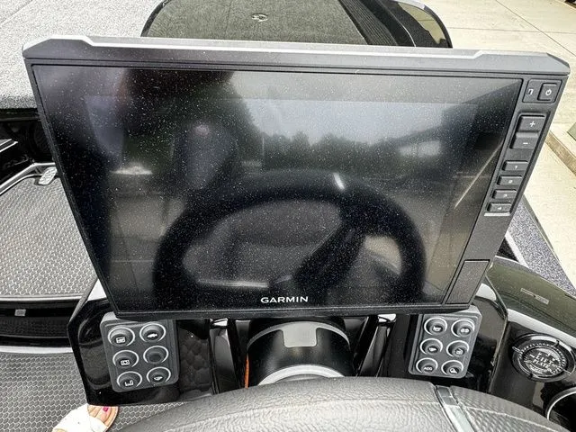 Slide: The Image of Garmin display on 2025 Ikon Boats VLX21 dashboard with control buttons. - 7