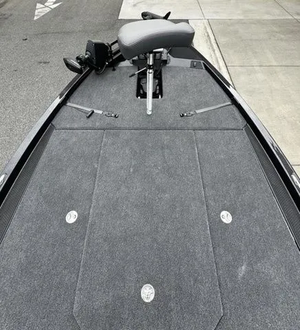 Slide: The Image of 2025 Ikon Boats VLX21 fishing deck with gray seating and storage compartments. - 8