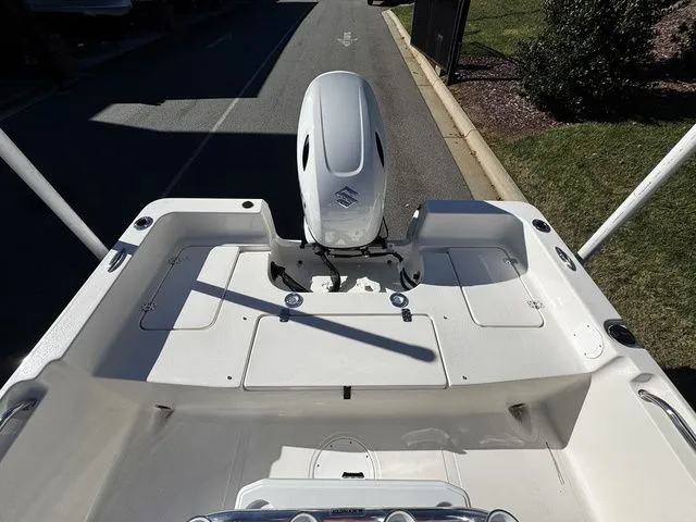 Slide: The Image of Bulls Bay 2000 boat, 2025 model, featuring a sleek white deck and powerful outboard motor. - 10