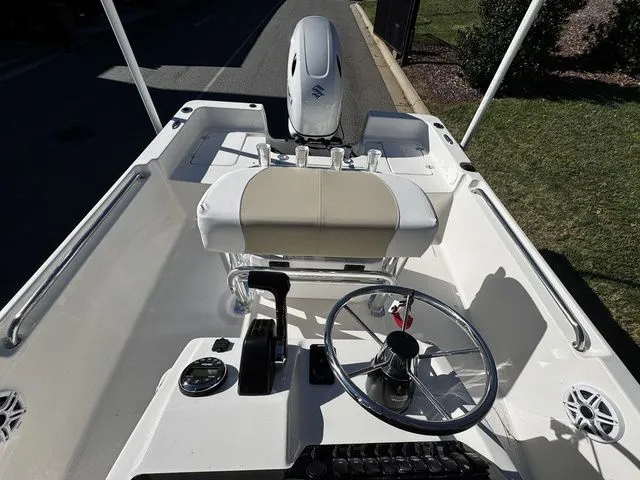 Slide: The Image of 2025 Bulls Bay 2000 boat interior with steering wheel and controls, viewed from above. - 9