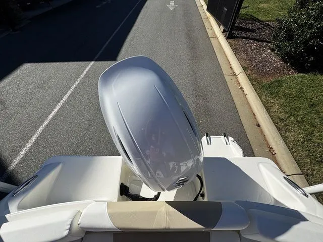 Slide: The Image of 2025 Bulls Bay 200CC boat with a sleek outboard motor, viewed from above. - 12