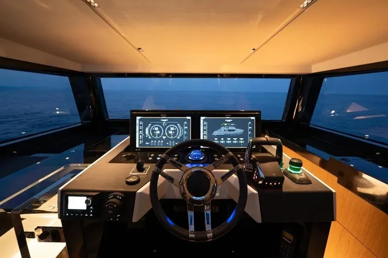Slide: The Image of Helm of 2026 De Antonio Yachts D60, featuring modern navigation displays and sleek design. - 13
