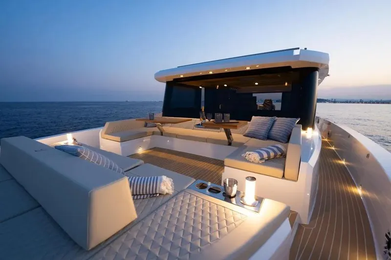 Slide: The Image of Luxurious 2026 De Antonio Yachts D60 with elegant deck seating at sunset. - 14