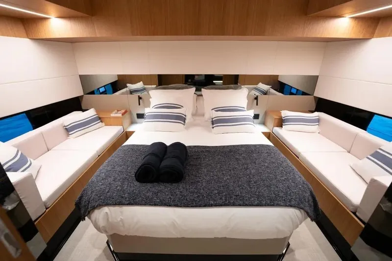 Slide: The Image of Luxurious interior of 2026 De Antonio Yachts D60, featuring a cozy bedroom with elegant decor. - 3