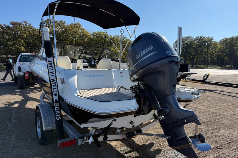 Slide: The Image of Close-up of a 2023 Stingray 192 DC boat propeller on a textured surface. - 52