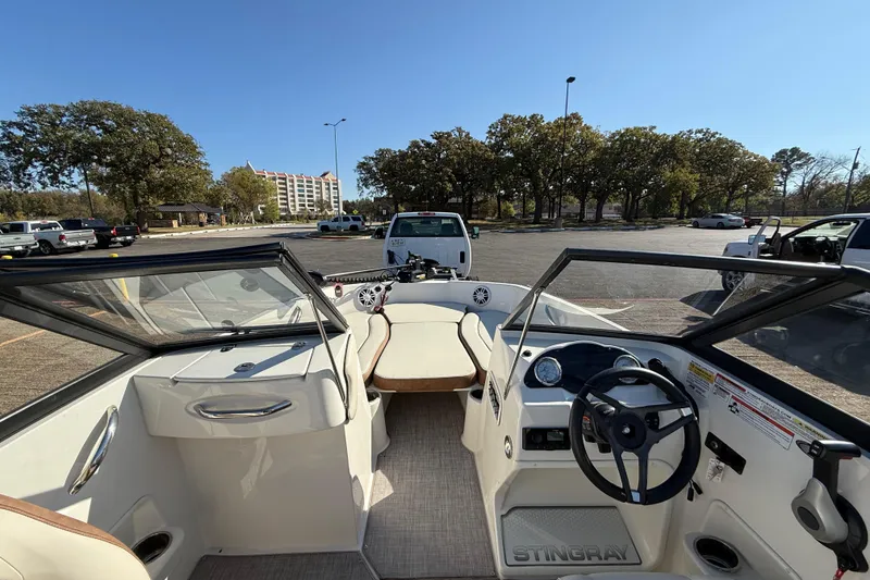 Slide: The Image of 2023 Stingray 192 DC boat with Yamaha outboard motor on trailer. - 9