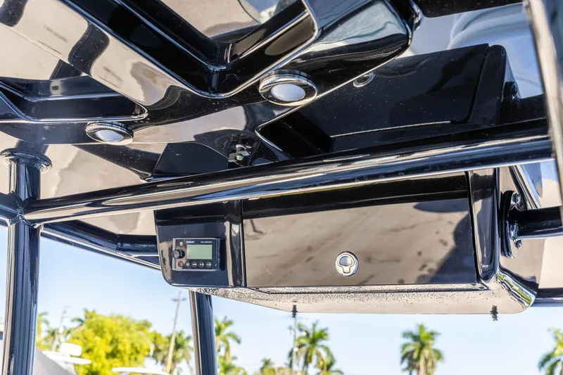 Slide: The Image of 2018 Crevalle 26 Open boat console with electronic controls and sleek black finish. - 12