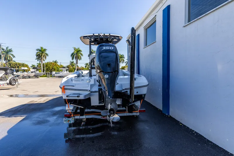 Slide: The Image of 2018 Crevalle 26 Open boat with powerful 350 engine, parked outdoors. - 9