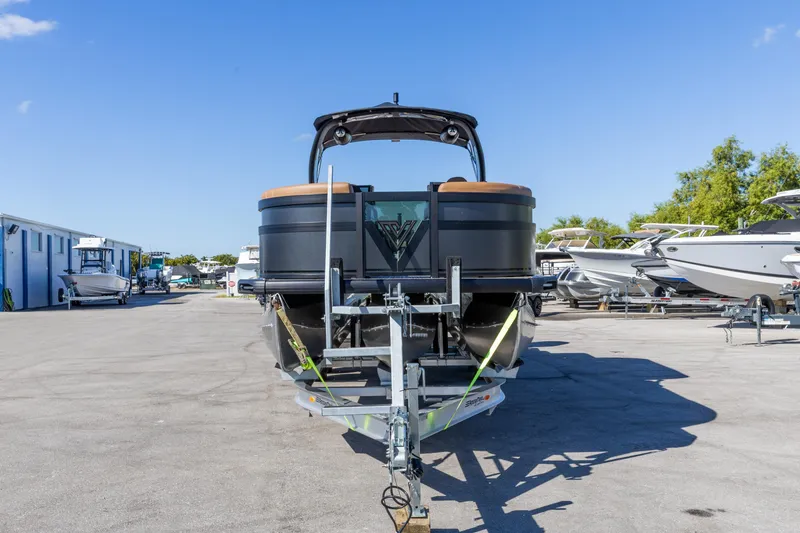 Slide: The Image of 2026 Viaggio Diamante UWA boat on trailer in sunny marina setting. - 16