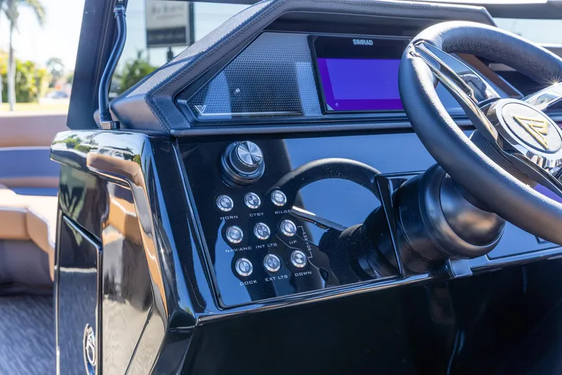 Slide: The Image of Steering console of 2026 Viaggio Diamante UWA with modern controls and display. - 25