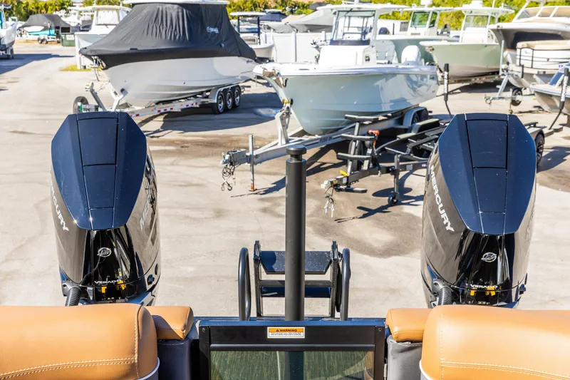 Slide: The Image of Outdoor boat storage with Viaggio Diamante UWA 2026, featuring dual Mercury engines. - 8