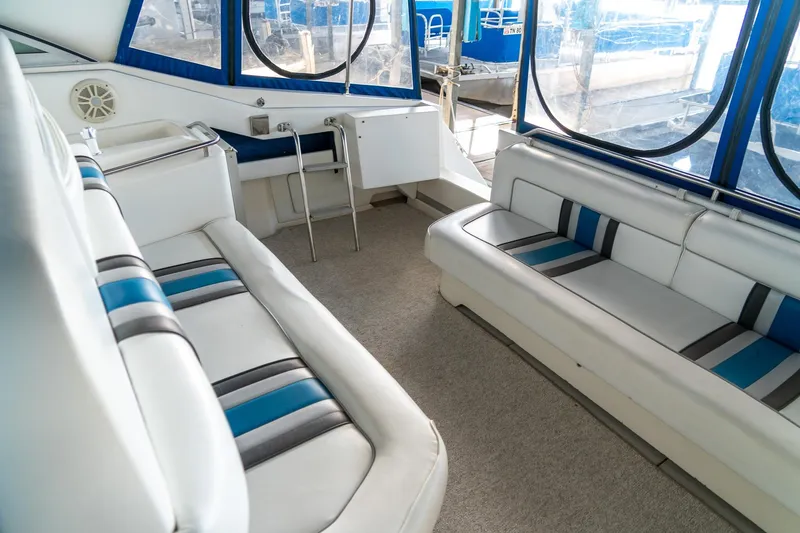 Slide: The Image of Interior of 1991 Sea Ray 350 Sundancer with blue and white seating. - 13