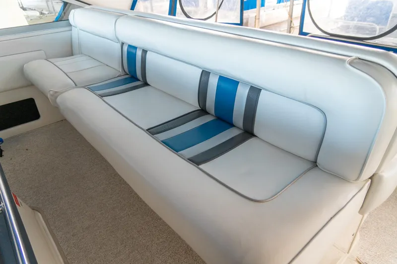 Slide: The Image of Luxurious seating on 1991 Sea Ray 350 Sundancer boat with blue and gray accents. - 19
